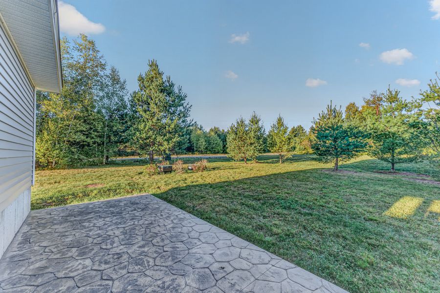 Stamped concrete patio and lawn